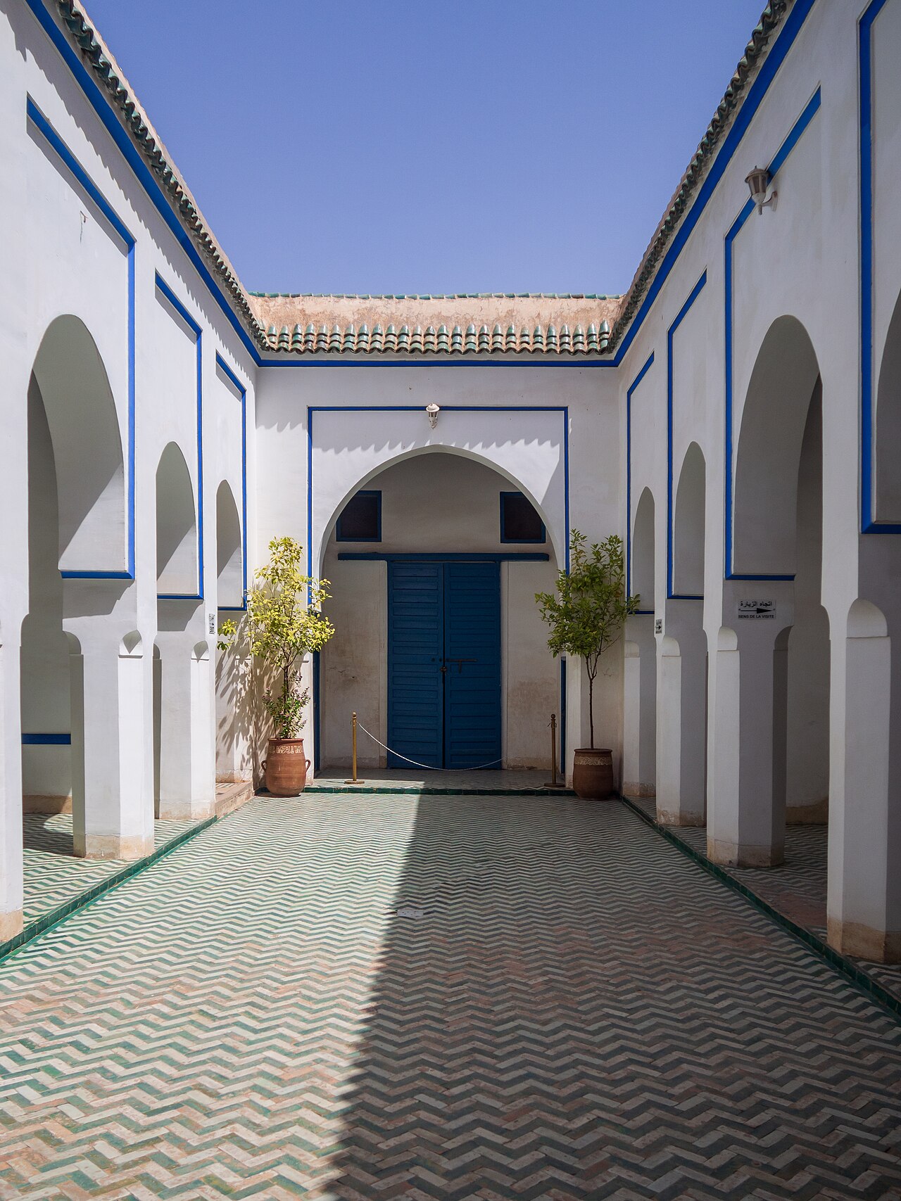 A blue doorway and arches in Bahia Palace’s entrance courtyard